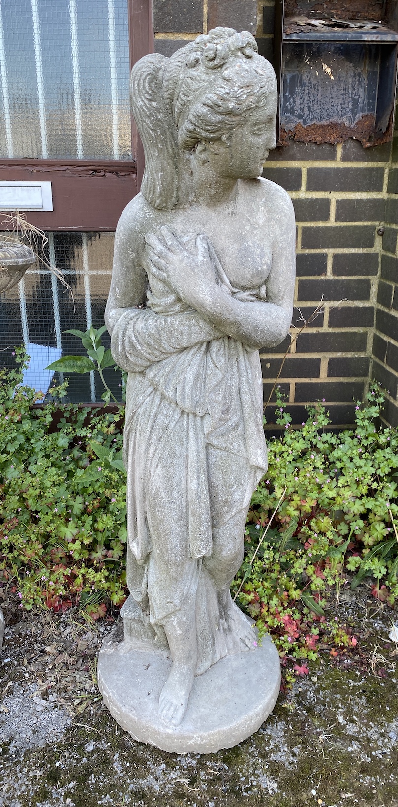 A reconstituted stone garden statue of a female bather, height 120cm